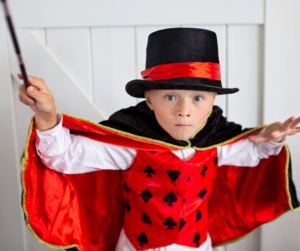 young-magician-boy-in-red-costume