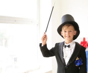 young-magician-boy-waving-wand